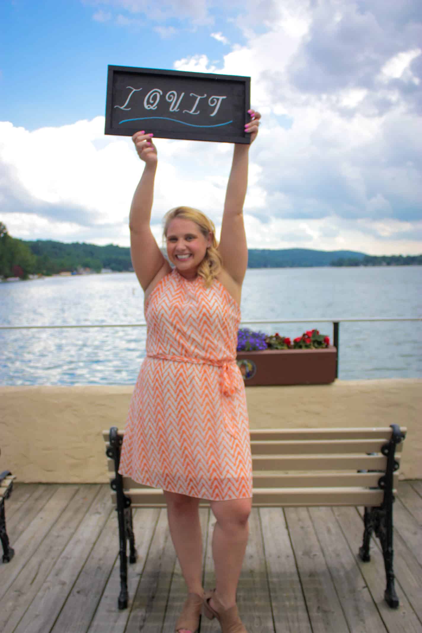 Joanna Flora keeping a I Quit sign