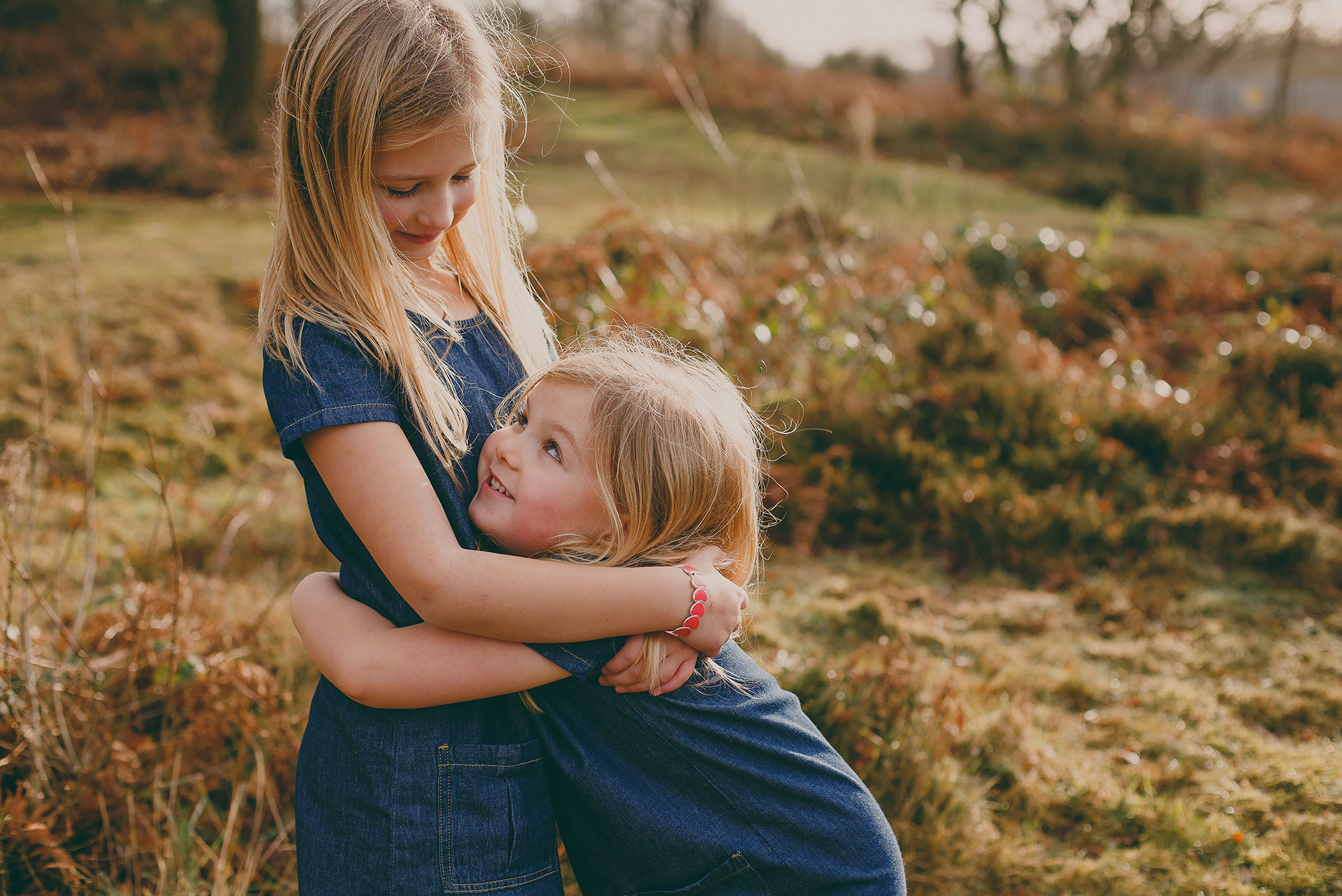 two-cute-blond-sisters-cuddling-outdoors-2026-03-09-04-36-05-utc Learn how strategic family therapy helps NJ families end sibling fights, reduce rivalry, and create lasting peace at home. Expert guidance in Sparta.